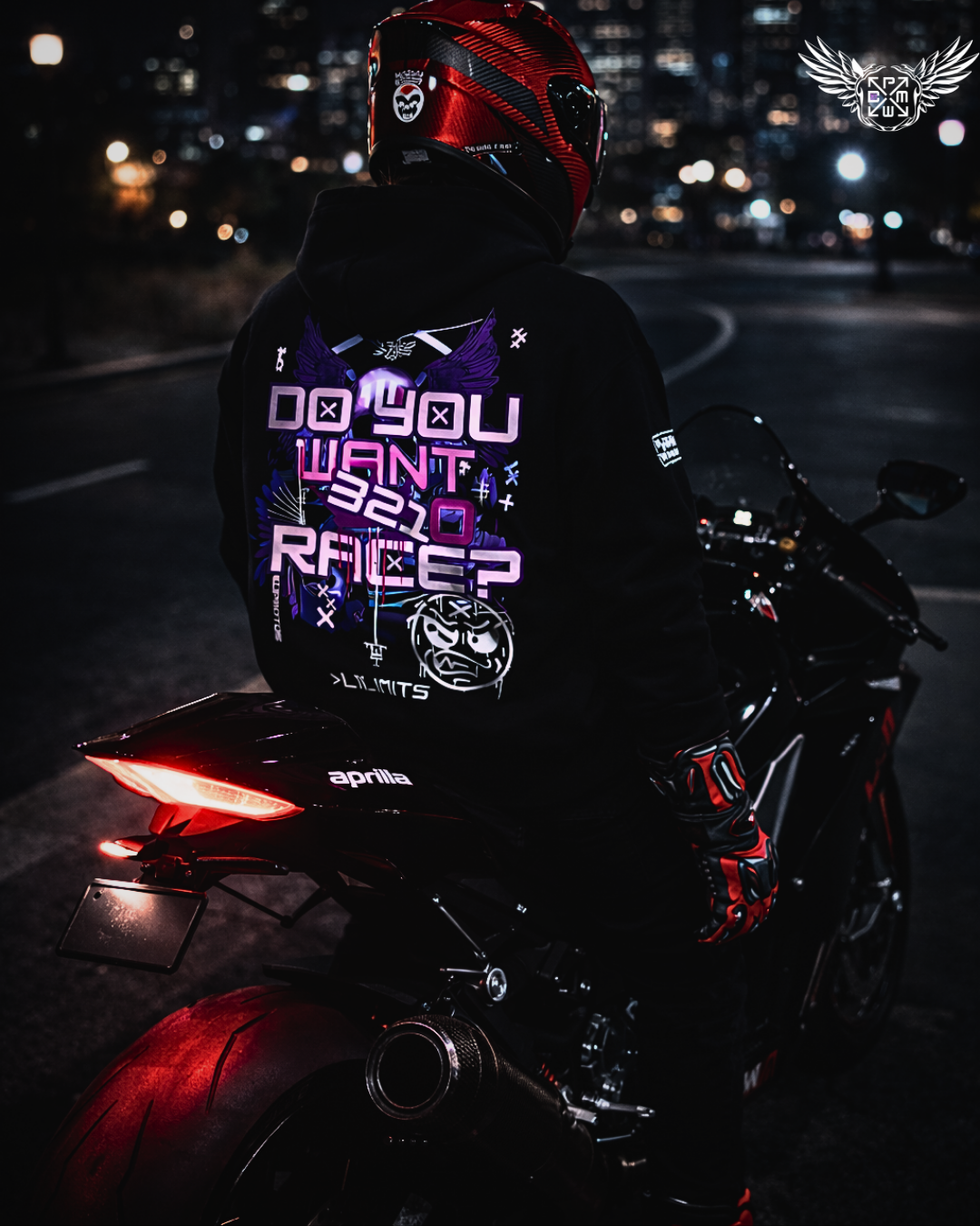 Person on a motorcycle wearing a dark hoodie with illuminated text at night.