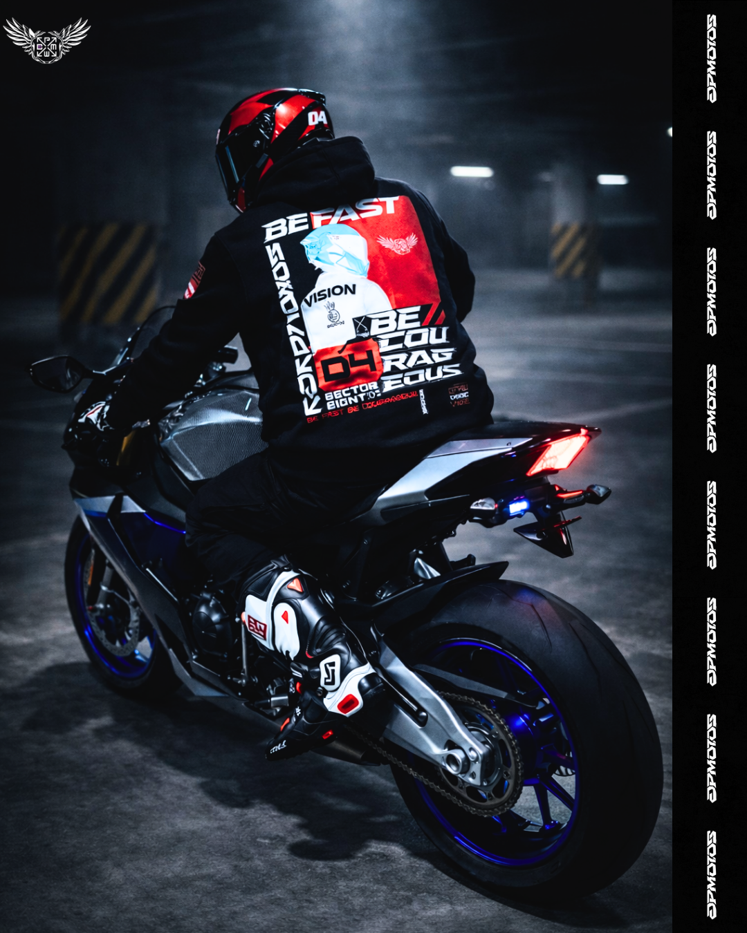 Sportbike rider wearing black DPMOTOS hoodie with red back graphic, riding in a dark underground parking garage, aggressive street racing mood, speed-focused motorsport lifestyle.